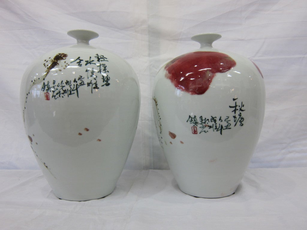 A matched set of Chinese fine porcelain artisan vases.  Beatufily hand formed and painted each signed by the artist with a poem.
Priced individually.