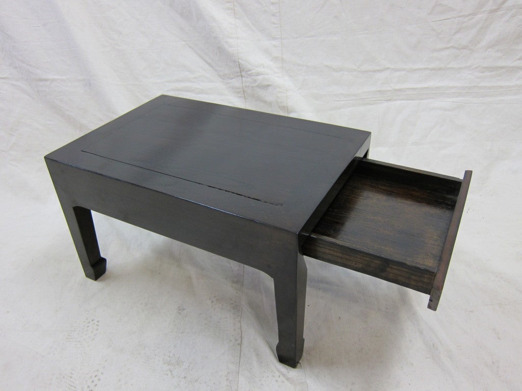Elmwood scholars hidden drawer low table. Well hidden drawer having legs with horse hoof feet. Can be used as side table, perfect for tight spaces, drink and book table and or art display stand.
We have two matching pieces. Priced individually.