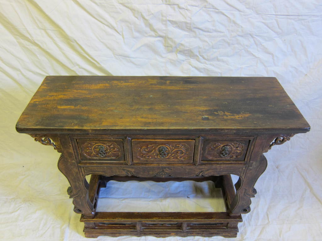 Imperial 19th Century Carved Wine Table raised on stand with three drawers.  Exceptional table having scalloped apron with carved spandrels and carved Rams legs front set on stand of importance.  A very significant table.    

Chinese Altar table,