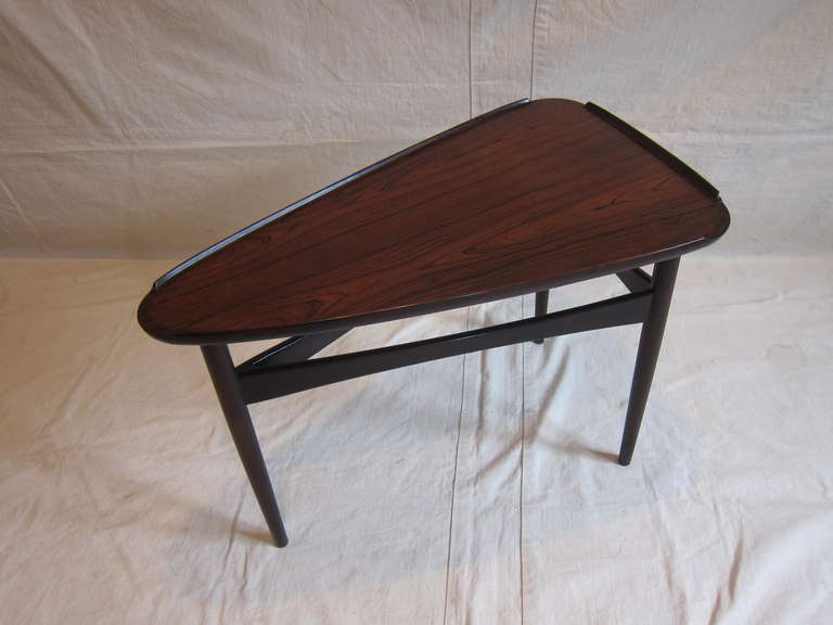Designed by Erik Kolling Andersen made by Peder Pedersen an Askew Three Sided Table in rosewood.  Rare early piece by master craftsmen premier furniture makers of the period.  
Demark, 1950
Ejnar and Lars Peder Pedersen started PP Mobler in 1953,