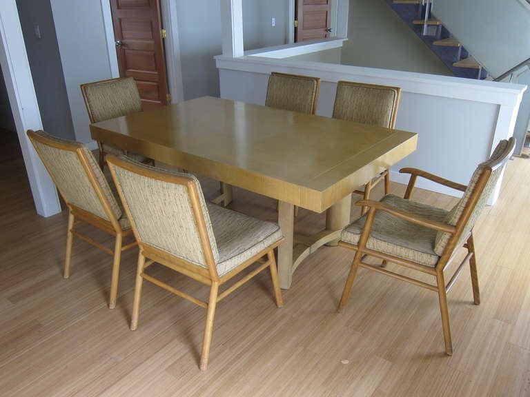 Robsjohn Gibbings Table and Chair Set for Widdicomb.  
In need of new upholstery, some surface abrasions and ware are present. 

Chairs can be refinished and reupholstered for an additional cost. 
Fabric COM. 
Table can be refinished for an