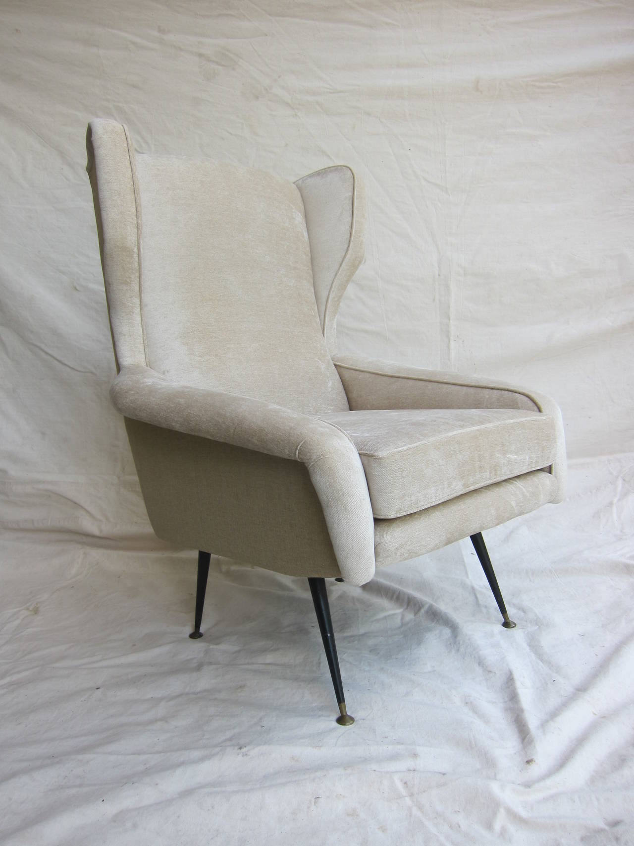 1950 Italian Winged Lounge Chair in the style of Gianfranco Frattini.  Wonderful style with great comfort.  Newly upholstered.