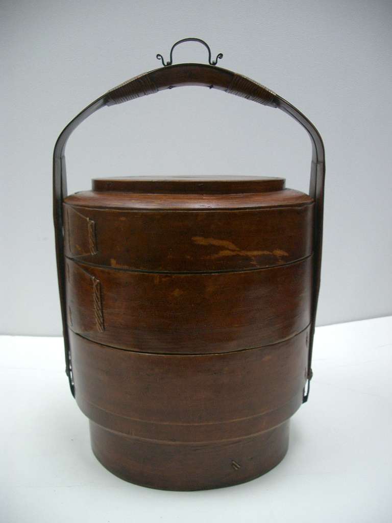 Wonderful 19th century food caddy basket with two compartments that are also used to serve. Turned woven bamboo with reed and wood. This type of food caddy is often associated with DIM Sum serving. Excellent condition commensurate with age and use.