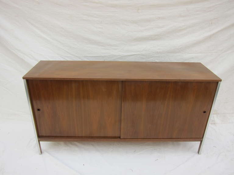 Paul McCobb For Calvin Sideboard, Walnut with Aluminum appointed legs. 
In house refinishing available for an additional fee.