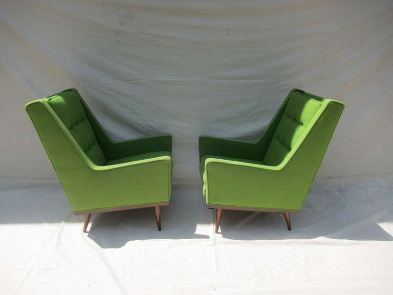 A Pair of Early Milo Baughman Highback Lounge Arm Chairs.  Very nice pair in very good condition, in need of new upholstery.  Exemplary lines of the period, extremely comfortable.