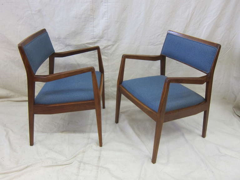 A pair Jens Risom walnut armchairs model C140 Playboy chairs.  Iconic Mad Men era chairs.  All original in very good condition.   This is a great set of chairs.  Perfect as side chairs,  or additions to a set.   Fabric is original and in very good