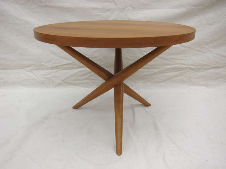 A Robsjohn Gibbings Tripod round Jacks Table in Honey Maple Original color for Widdicomb.  Very good condition.