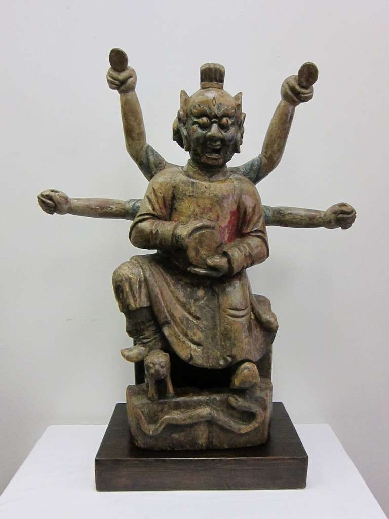 18th century or earlier Carved wooden Buddha Statue of Nezha; .  
A wonderfully carved interpretation of the manifestation of the Chinese Buddha Nezha, displaying his three heads and six arms.  This statue represents the joining of Buddhist and