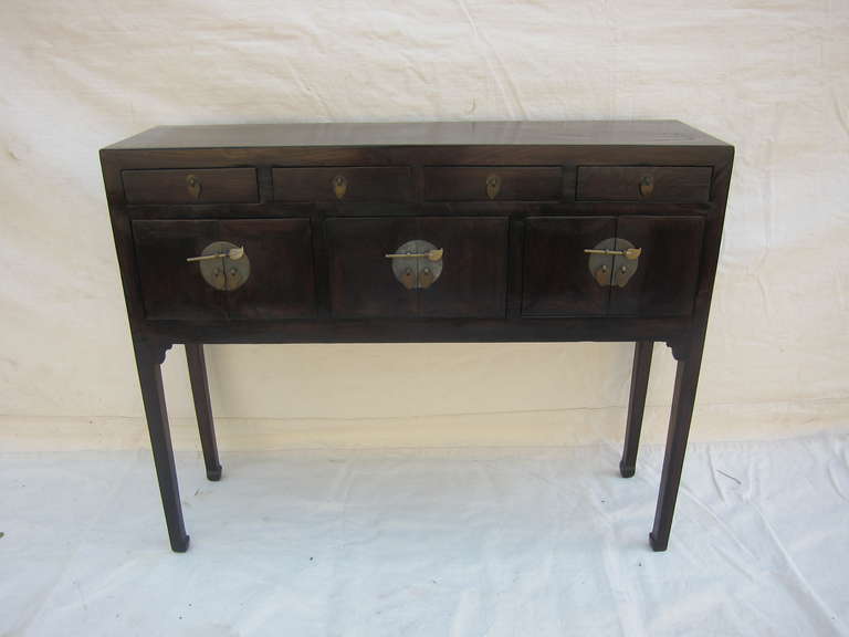 A 19th century Chinese Compartment Console table with four drawers and three lower compartments.  Elm wood with lacquer, circa 1880 <br />
Very good condition