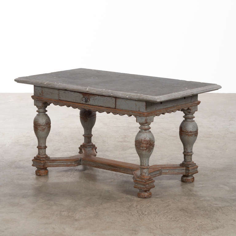 Exceptional 18th century Swedish baroque stone top table, wonderful scalloped apron, original rare blue stone top, raised on baluster turned legs with a box stretcher.  Proportionately perfect, a most charming patina, in very good condition. 