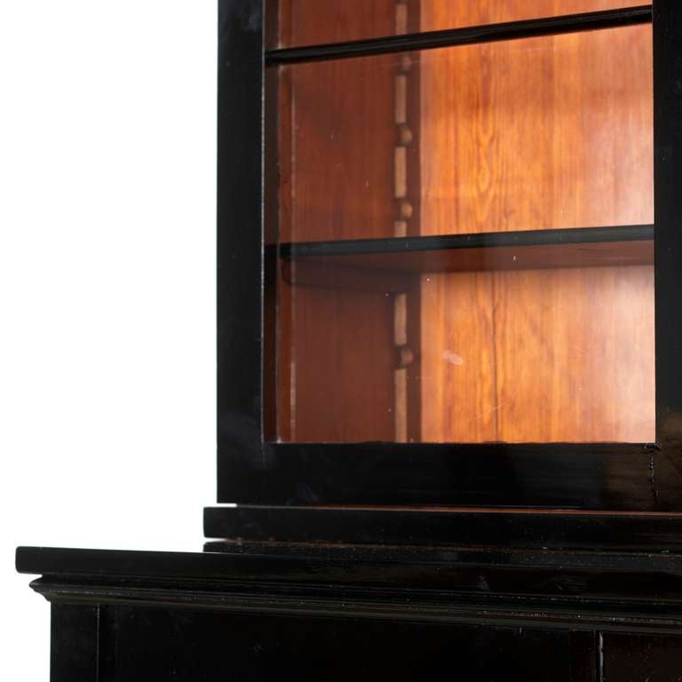 Elegant Danish late Empire Glass Display show Cabinet, black French polished (ebonized), 1830 Top part with glass doors and glazing bars, lower cabinet with interior shelves.
  Excellent.