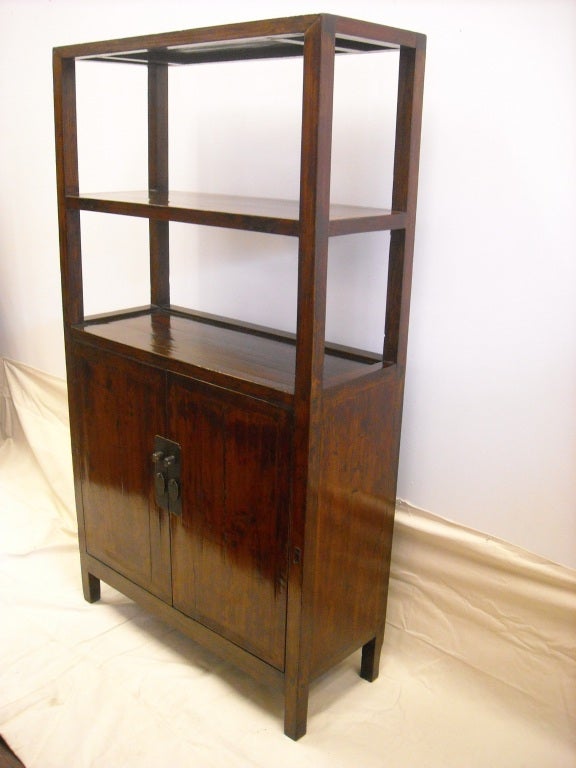 19th century elm wood Scholars case. Clean lines with lower compartment cabinet storage. Offers nice storage and shelving with clean lines. In good condition, beautiful and perfectly functional.  This piece has warm rustic patina with a minimal