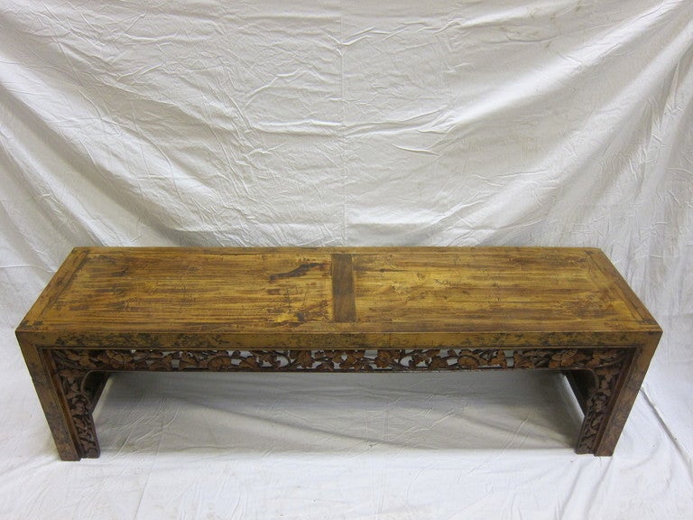 19th century Chinese carved low table bench. Aspen wood with carved apron, circa 1870.