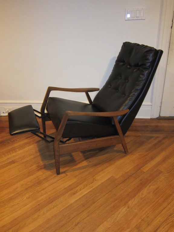 Mid Century Milo Baughman Recliner for Thayer Coggin, Solid walnut frame with Black leatherette vinyl.  Very good working original condition. Walnut frame is in very good condition.  Leatherette vinyl in very good shape no rips or scratches. Light