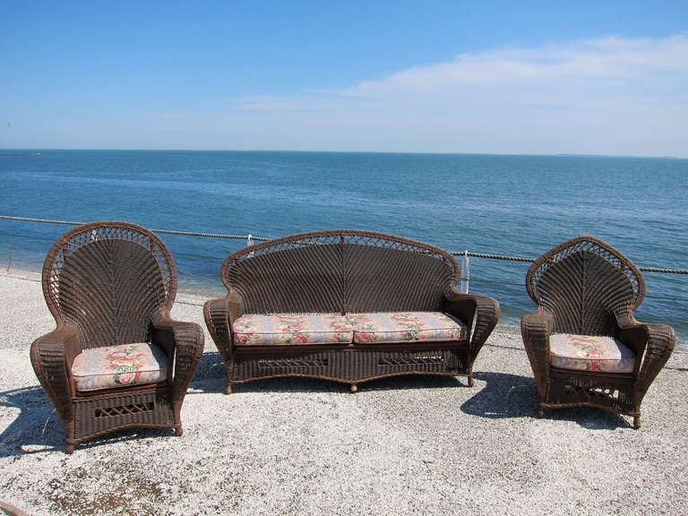 Rare Deco Wicker  three piece high style set in original finish.  Pieces sit comfortably and are generous in size.  Matching tables, lamp and bird cage sold separately.

Sofa 80