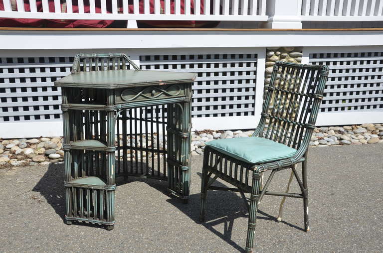Stick rattan desk and chair in old green and black paint.  Some chipping to the paint finish.  Matching pieces available under separate listings.