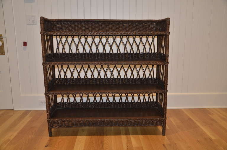 Antique Fiber bookcase with oak shelves.