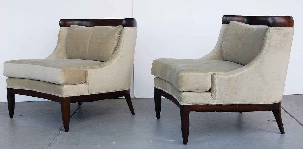 A pair of comfortable and great looking chairs. Beautifully crafted in dark walnut.