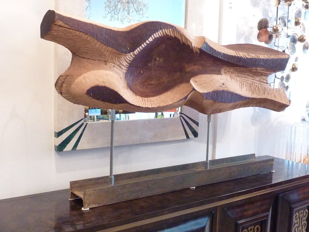 Very large and dramatic wood sculpture, done in the brutalist style. Carved out of a single pice of wood with a steel 