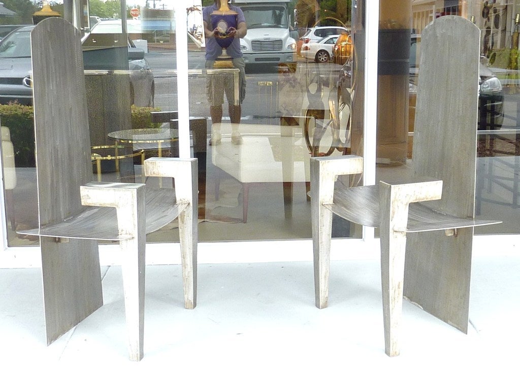 Pair of sculptural stainless steel chairs in the style of David Smith. Geometric legs, curved seat and tall backs. One of a kind pair for sure.