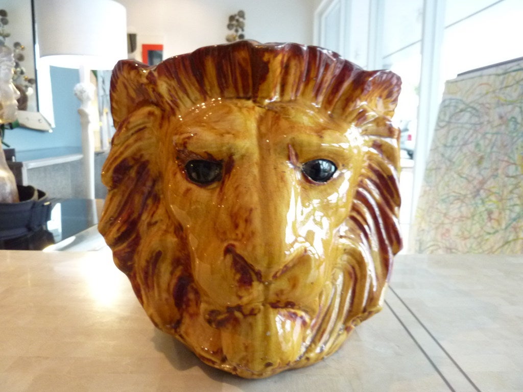 A large jardiniere by Anthony Redmile in the shape of a lion's head. Signed on bottom.