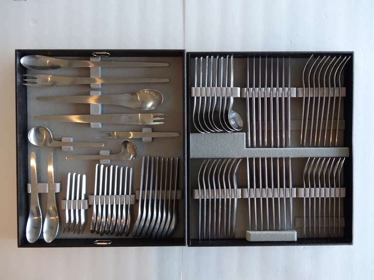 A large complete serving for 8 plus serving pieces. Each serving consists of 8 pieces. There are 2 extra spoons, 12 serving pieces and one left handed spoon. These pieces show very little use if any. They come with the original fitted trays. 