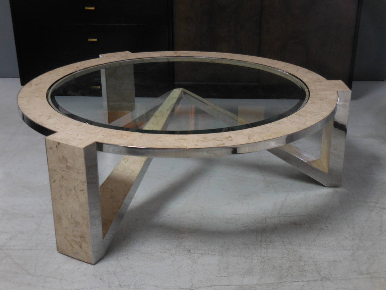 A rare coffee table by Gene Jonson and Robert Marcius. Tessellated stone and mirror polish stainless steel.