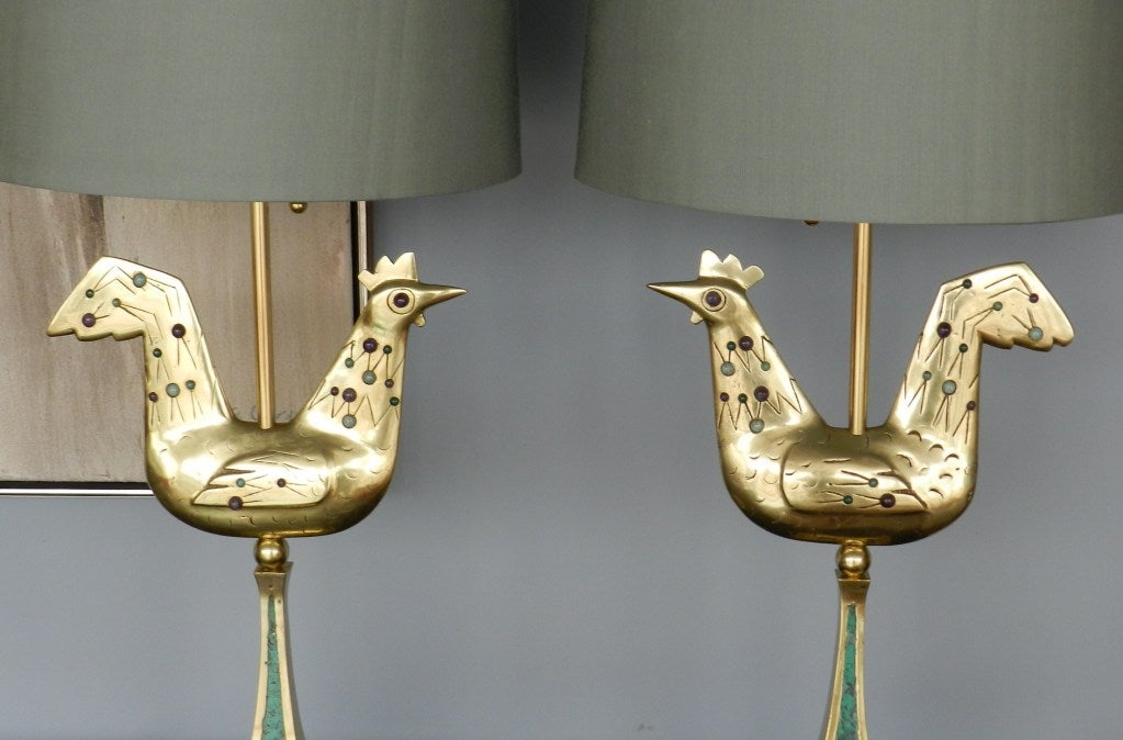 Incredible pair of lamps. Solid brass cast of stylized roosters, adorned with semiprecious stones on a brass and enamel base. Exquisite modernist lines. These are jewelery for a room, quite remarkable!