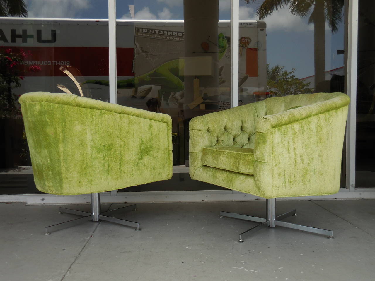 A seldom seen pair of swivel chairs by Milo Baughman. Original plush upholstery on crossed bar bases. Super comfortable and great looking from any angle. Note the polished and brushed combination of the bases, subtle interesting detail.