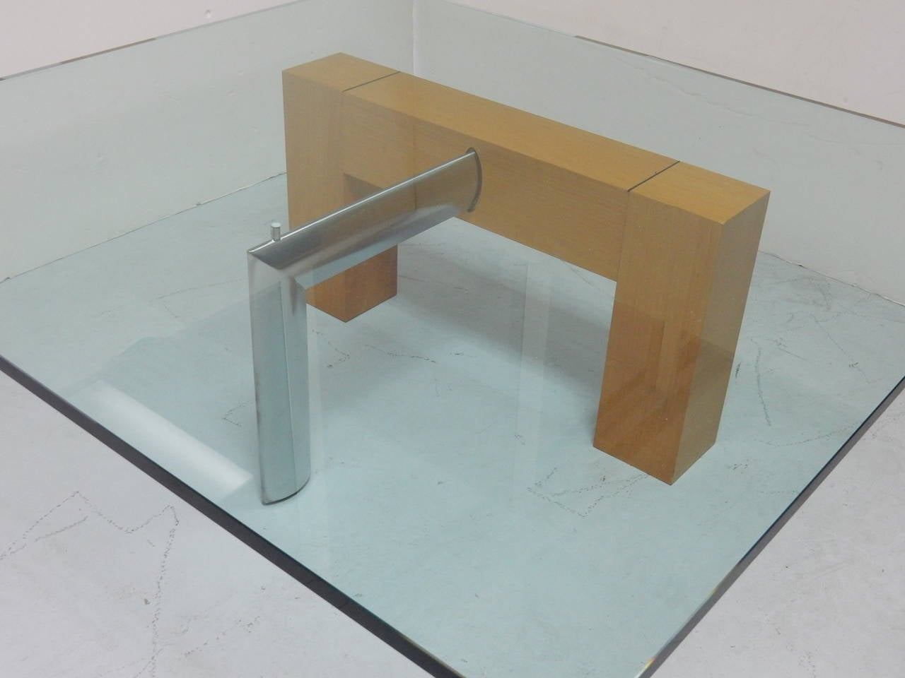 Coffee table by Daniela Puppa for Fontana Arte. Simple design yet robust and visually dynamic. Perfect balance of wood, glass and metal. Glass top is signed on corner.
