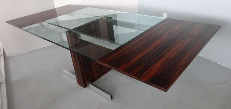 Exquisite dining or conference table by Vladimir Kagan. Impeccable marriage of glass, metal and wood. Genius design, both in its simplicity and sophistication. Very active veining and color on the wood.