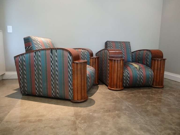 Pair of south African Art Deco chairs. Handsome and dynamic design. Large column fronts that allow surface for drinks.