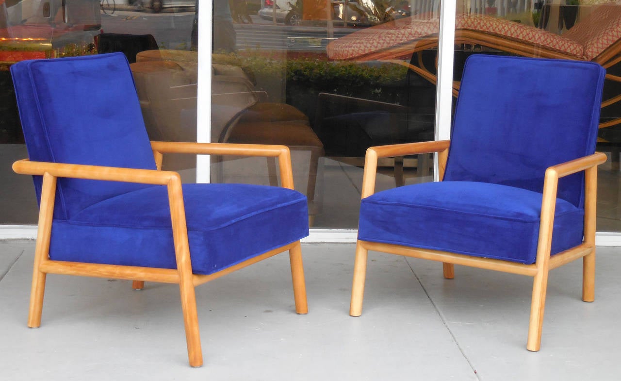 Very exciting pair of lounge chairs. Solid dowel style frames and upholstered seats and backs. Note the interplay among the multiple trapezoid shapes, some of them intersecting at different planes , pure genius!