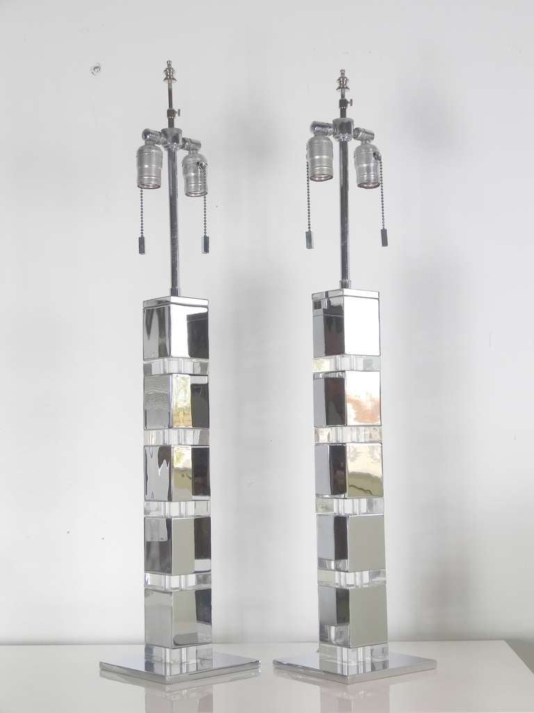 A striking pair of lamps, chrome cubes with Lucite sections in between. A very tailored look, both timeless and modern at once.