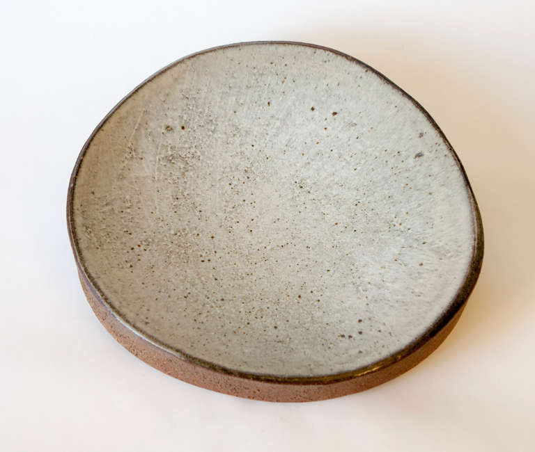 David Shaner is a celebrated leader of American ceramics, and was the resident director for the Archie Bray Foundation. 

This piece is glazed stoneware, made at Archie Bray between 1963 & 1964. Shaner called this a bird bath, but would be a