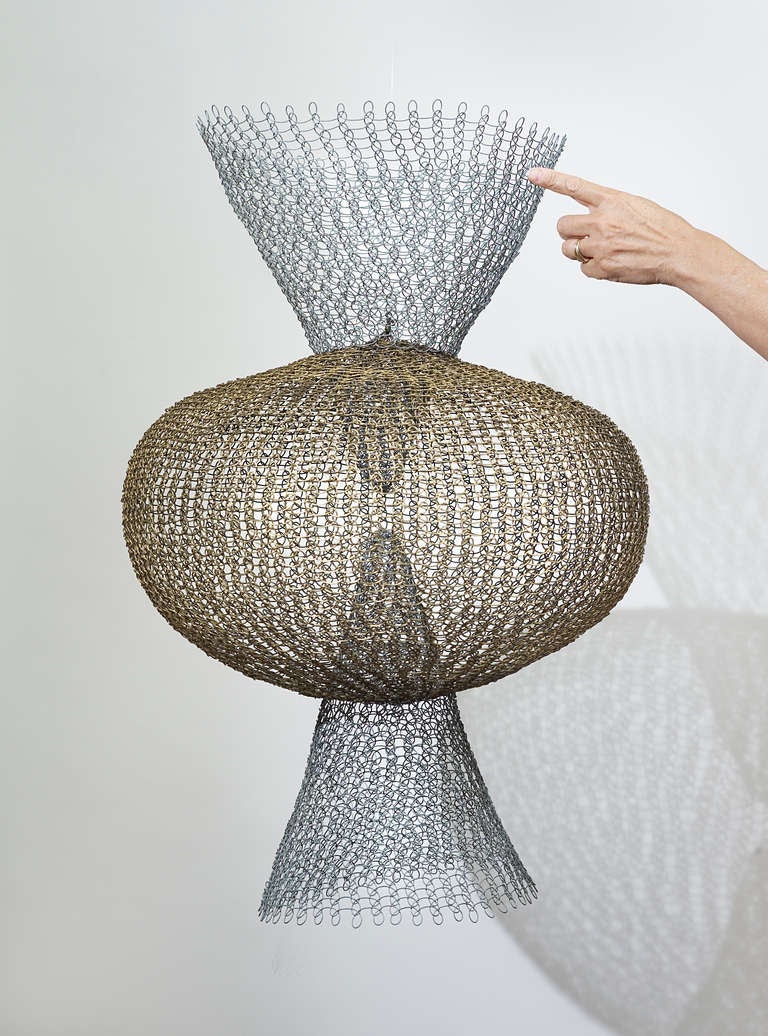 Great era, clean original patina, cataloged, no breaks etc very good condition, Galvanized Wire and Brass wire in Gold & Silver tones.

Published in Asawa's Retrospective book, 