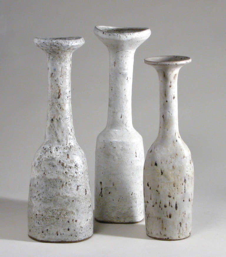 Lucie Rie is one the most important British artists in studio ceramics and craft. Along with Hans Coper, Rie lead studio ceramics into the modern era. These are some of the largest goose neck vases Rie ever made. Each is covered in her oatmeal glaze