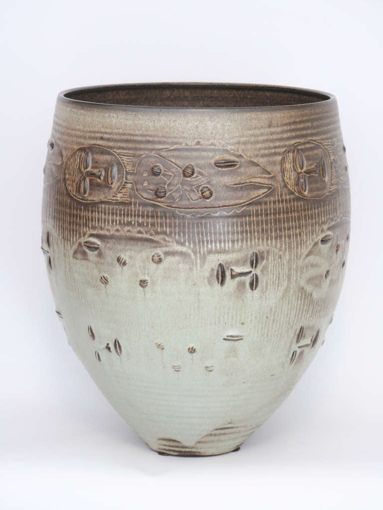 The Scheier's are among some of the top studio potters in the United States. Known for their tribal and indigenous people's references and figurative drawings, this is a Classic piece.