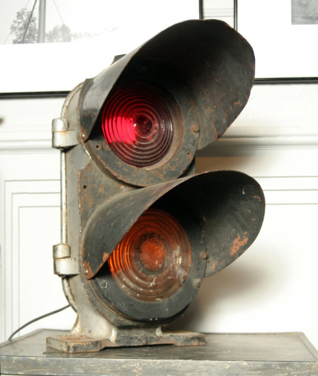 Vintage cast iron trackside control light with thick, heavy ribbed glass red and yellow lenses. Rewired for household current.

Like all of our industrial items, this one-of-a-kind piece is true, unique, authentic vintage--not something that's