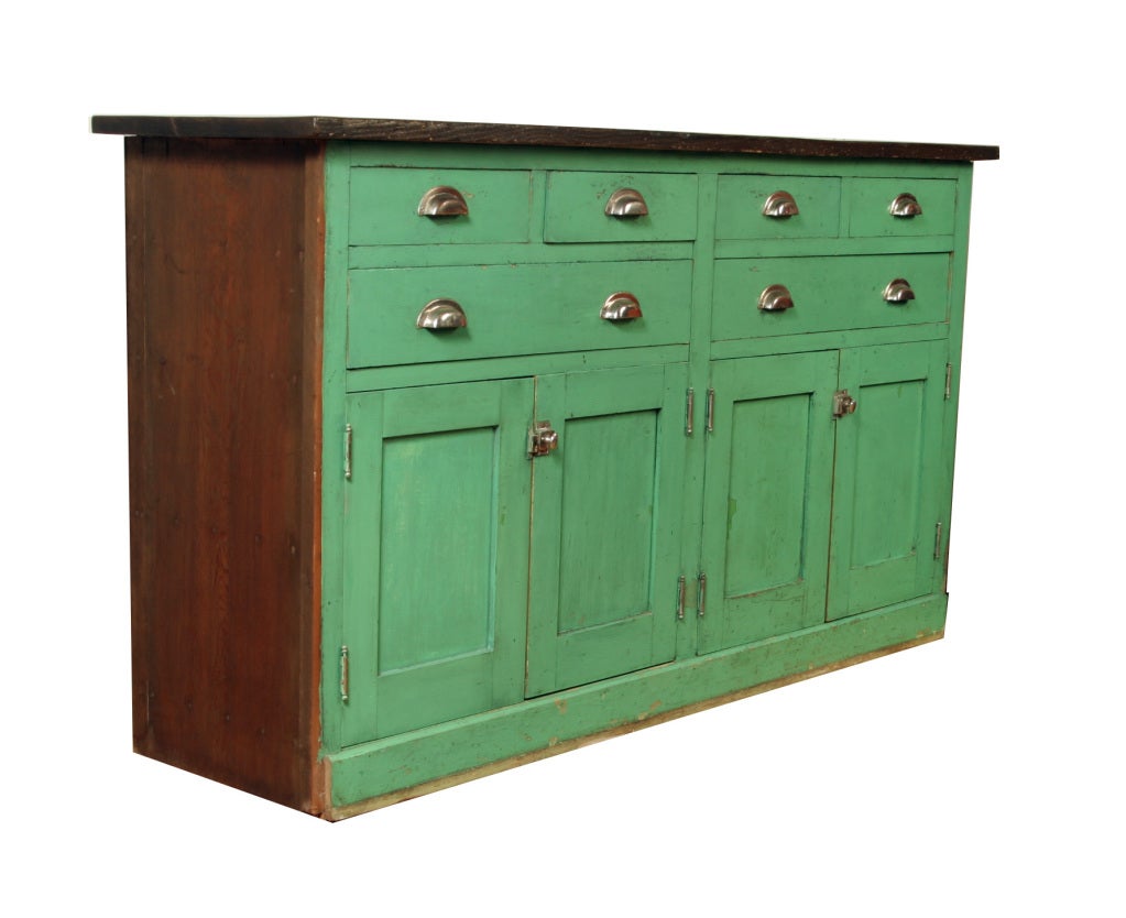 This handsome cabinet has come straight out of the lab, bearing all the hallmarks of an authentic vintage piece: heavy nickle hardware, solid hardwood construction and its original laboratory green paint.  The configuration of drawers and doors