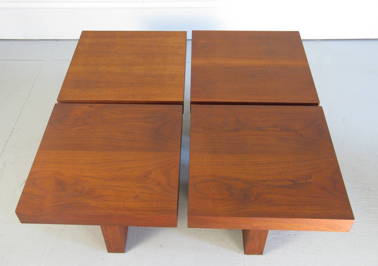 Very good looking walnut tables by Milo Baughman, these handsome tables are very versatile as end tables or one nice size coffee table.