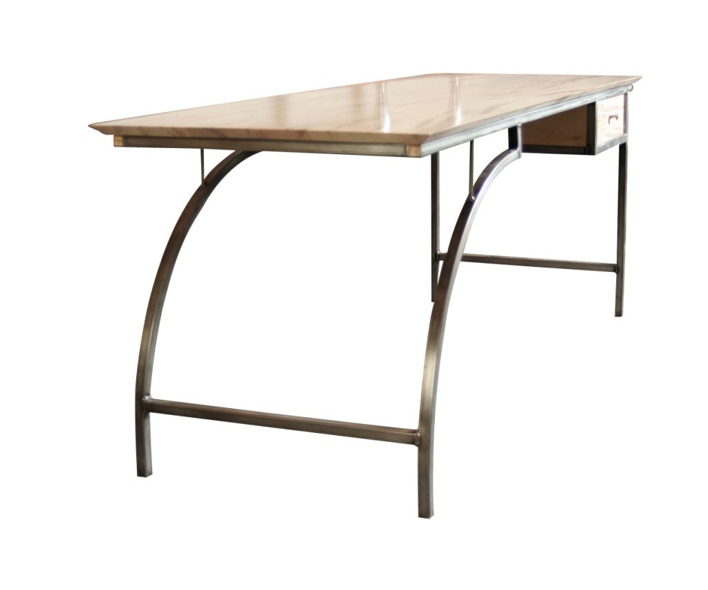 This one-of-a-kind desk was designed and handcrafted by Doyle:Hudson co-owner Denis Ferentinos.  The frame is made of welded steel, and the top is solid reclaimed Spalted Maple.  The dramatic grain pattern of the wood and the arched leg combine to