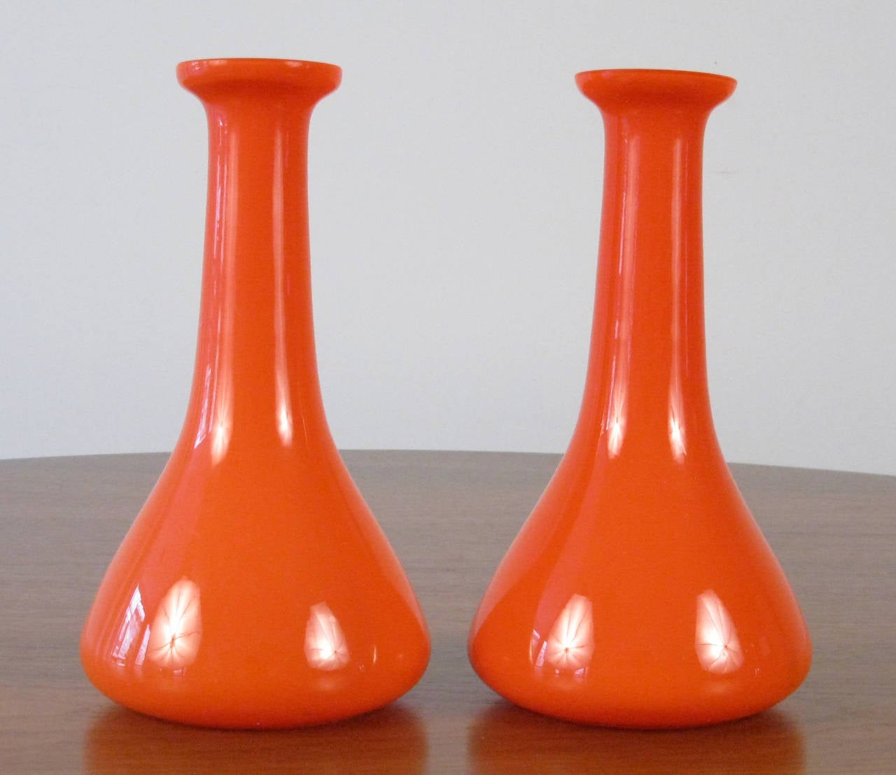 I just like these blown glass bud vases because of their orange color and they look like the Gemini space capsules. Partial label.