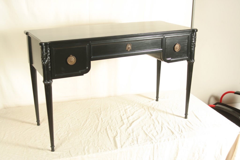 This elegant John Widdicomb Hollywood Regency desk in black lacquer is an outstanding piece if furniture in every sense.  Designed by one of the preeminent talents of his era, it is meticulously crafted and built to last for centuries.  It will be a