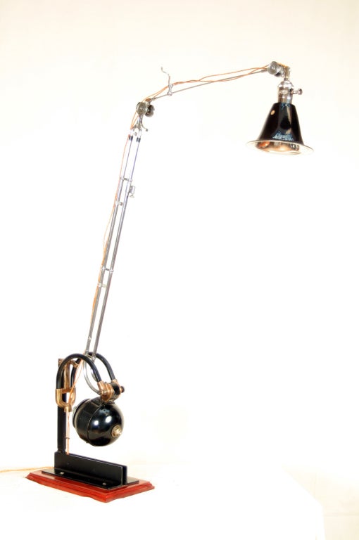 This one-of-a-kind lamp has been made from a 1920s era Ritter Dental Drill Model B by Doyle:Hudson co-owner Denis Ferentinos. The chrome arms are fully adjustable, the socket is equipped with a chrome dimmer switch, and the cloth-covered wire used