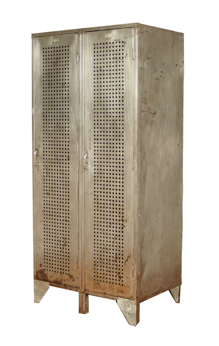 This bank of two lockers not only has the aesthetic advantage of the wonderfully graphic perforated steel doors, it has the structural advantage of being distinctly oversized.  Unlike the high school hallway and gym lockers of the period which were