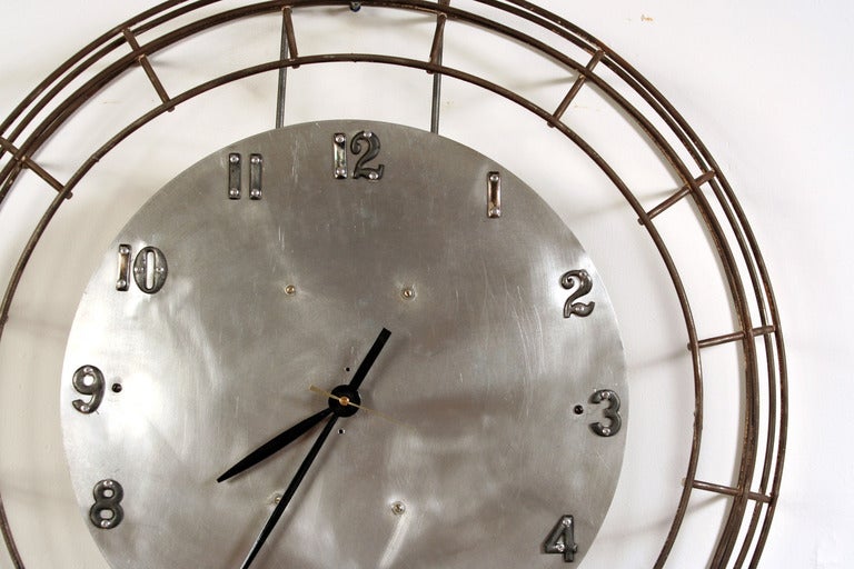 This one-of-a-kind clock features a brushed aluminum face surrounded by a vintage welded steel rod cage. Designed and hand made by Doyle:Hudson co-owner Denis Ferentinos, it's powered by a heavy-duty battery movement.