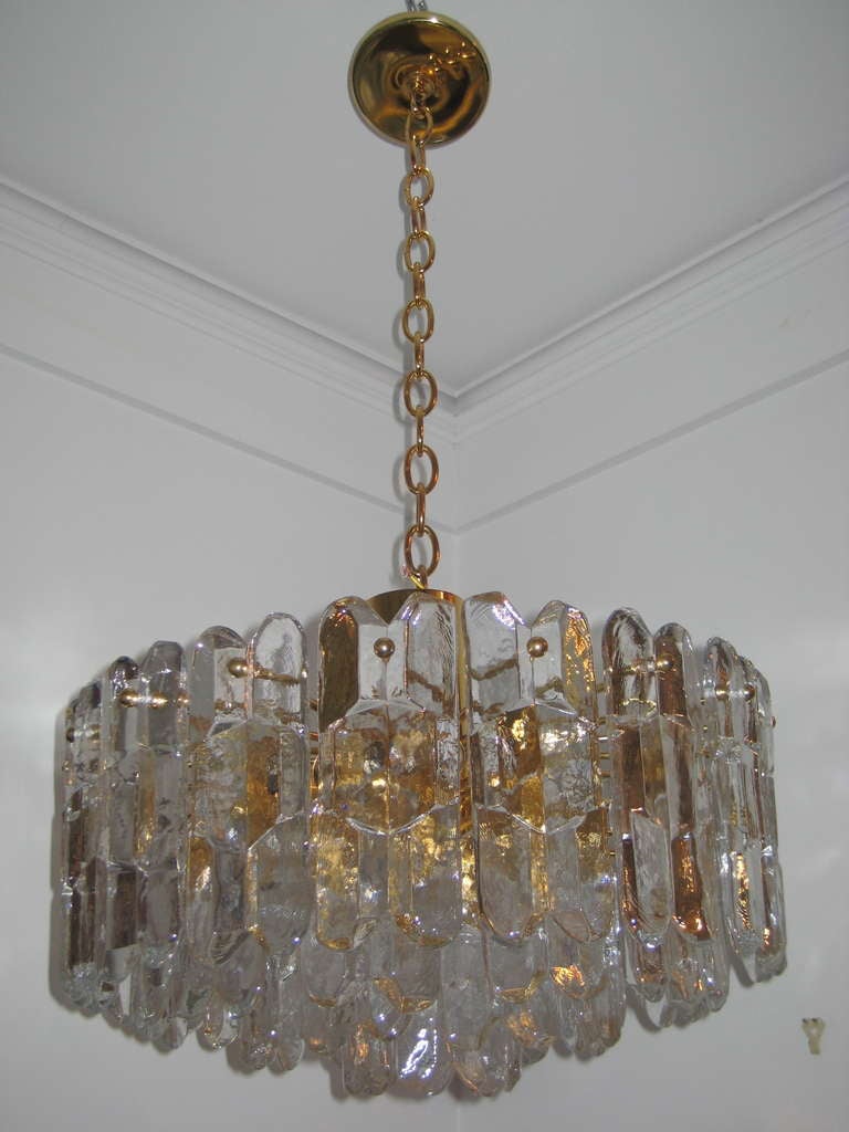 Superbly cast glass mounted on gold plated structure.