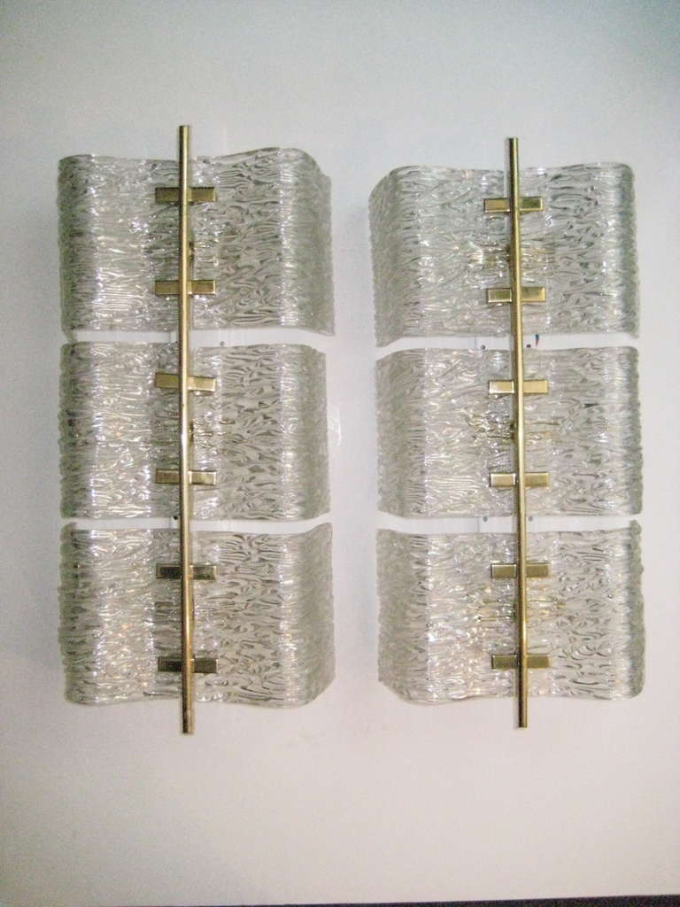 Heavy, high quality, textured glass handsomely mounted on a metal armature.