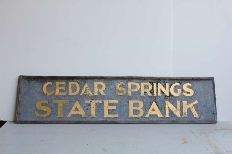 1900's tin advertising sign with gold leaf lettering 